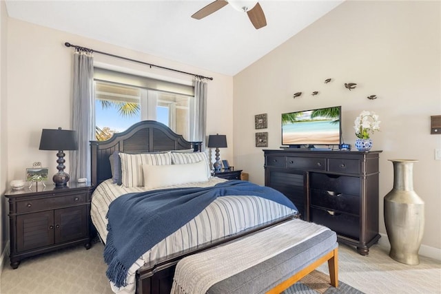 bedroom featuring ceiling fan, light colored carpet, and lofted ceiling