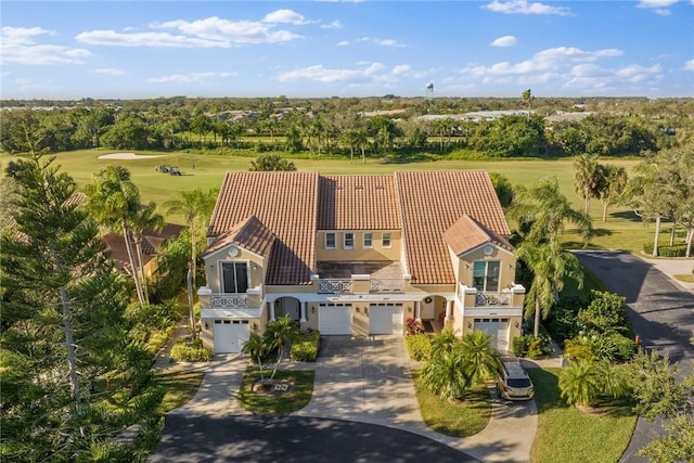 4877 N Newport Island Dr Unit 14D, Vero Beach, FL 32967 - view of subject property featuring a tree filled landscape and a local golf course