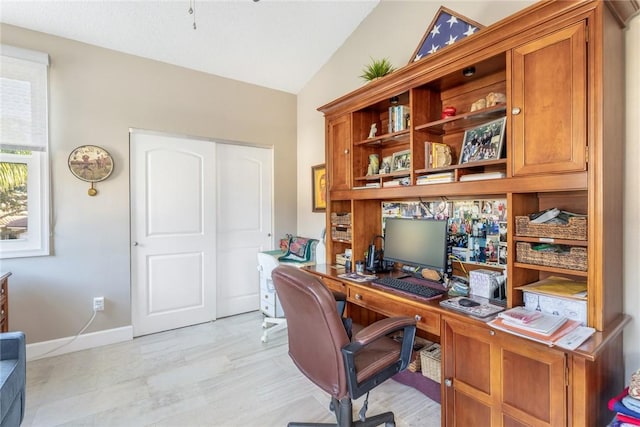 office space featuring vaulted ceiling