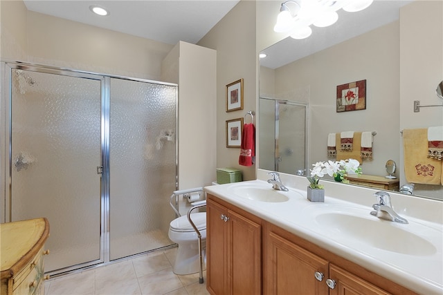 bathroom featuring walk in shower, toilet, vanity, and tile patterned floors