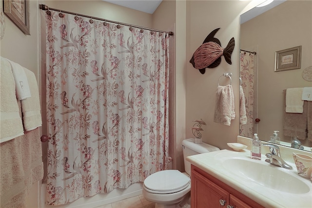 full bathroom with vanity, tile patterned floors, toilet, and shower / tub combo