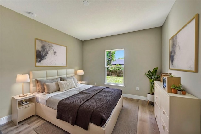 11126 Roseland Rd, Sebastian, FL 32958 - bedroom featuring light wood-type flooring and baseboards