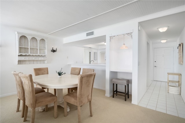 view of carpeted dining area