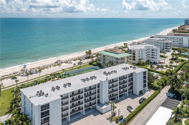 aerial view featuring a view of the beach and a water view