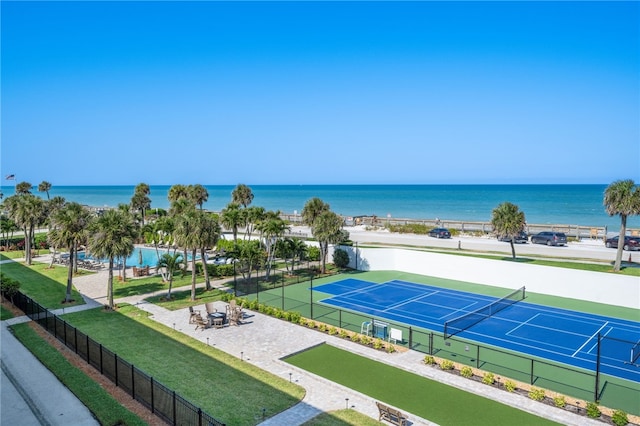 view of sport court featuring a water view