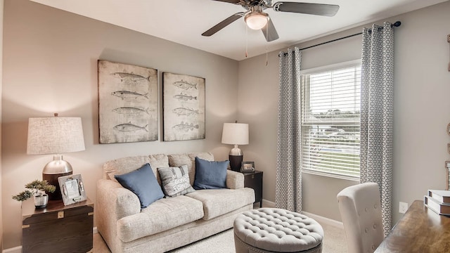 carpeted living room with ceiling fan