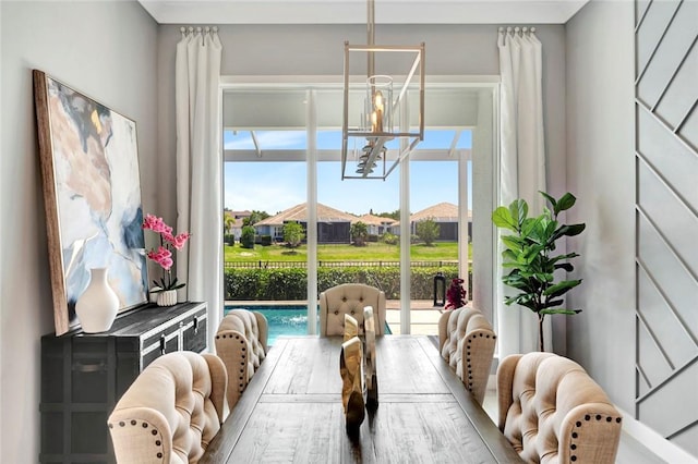 9378 Orchid Cove Cir, Vero Beach, FL 32963 - dining room with an inviting chandelier
