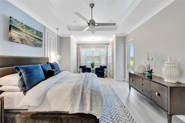 9378 Orchid Cove Cir, Vero Beach, FL 32963 - bedroom featuring ceiling fan, light wood-type flooring, crown molding, and a tray ceiling