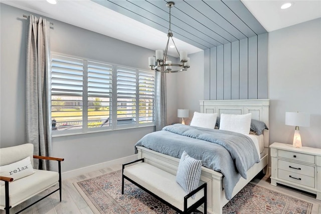 9378 Orchid Cove Cir, Vero Beach, FL 32963 - bedroom with an inviting chandelier, recessed lighting, light wood-style flooring, and baseboards