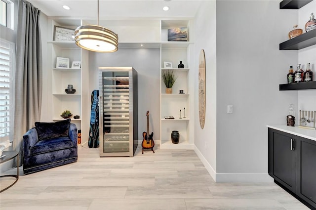 9378 Orchid Cove Cir, Vero Beach, FL 32963 - interior space with beverage cooler, plenty of natural light, built in features, and baseboards
