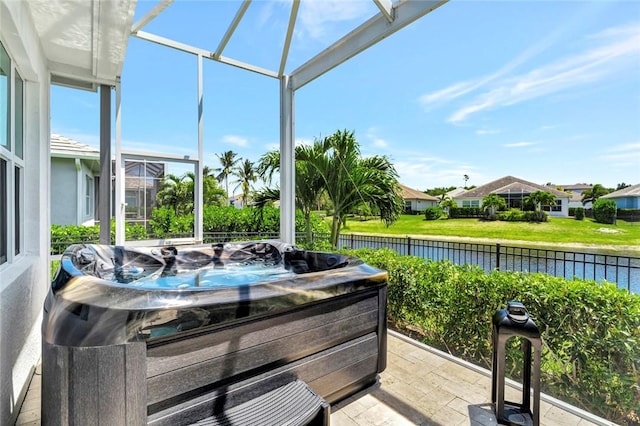 9378 Orchid Cove Cir, Vero Beach, FL 32963 - sunroom with a residential view, a water view, and a hot tub