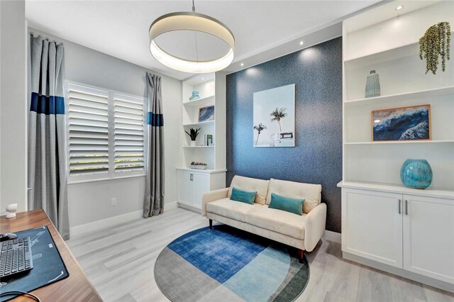 9378 Orchid Cove Cir, Vero Beach, FL 32963 - sitting room featuring baseboards and light wood-type flooring