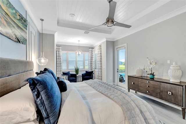 9378 Orchid Cove Cir, Vero Beach, FL 32963 - bedroom featuring wood finished floors, access to exterior, visible vents, a ceiling fan, and crown molding