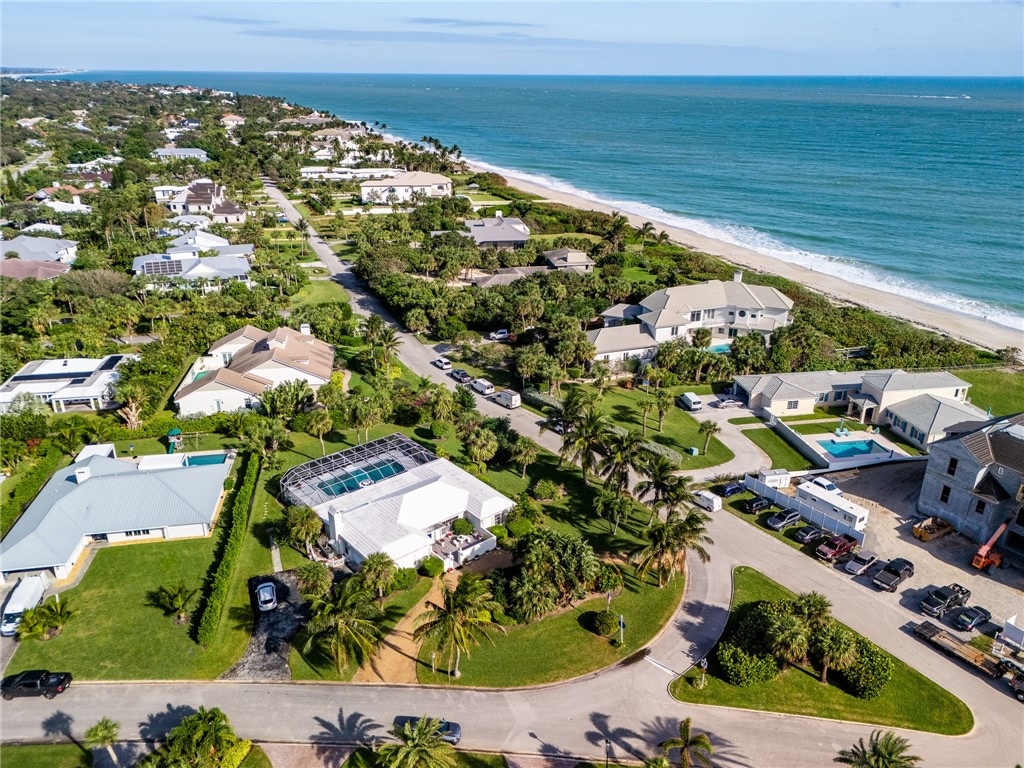 aerial view with a view of the beach and a water view