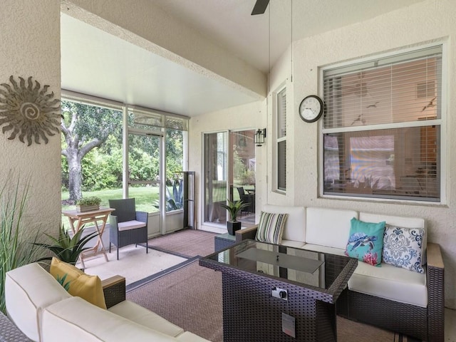 sunroom with ceiling fan