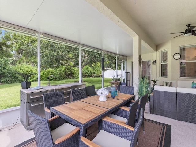 sunroom / solarium with sink and ceiling fan