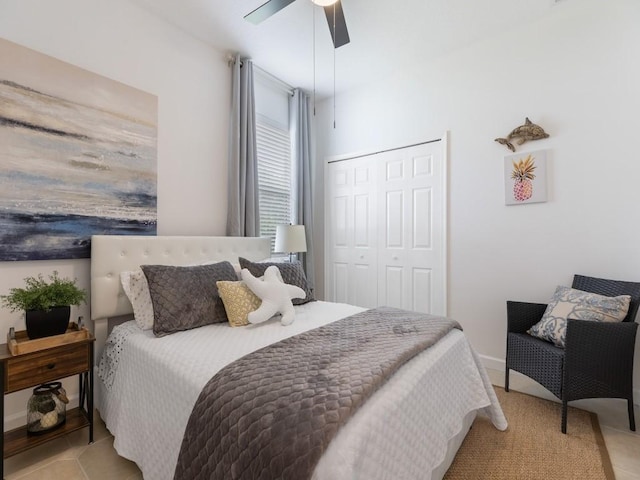 bedroom with a closet, ceiling fan, and light tile patterned floors