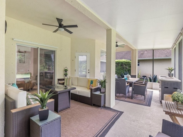 sunroom featuring ceiling fan