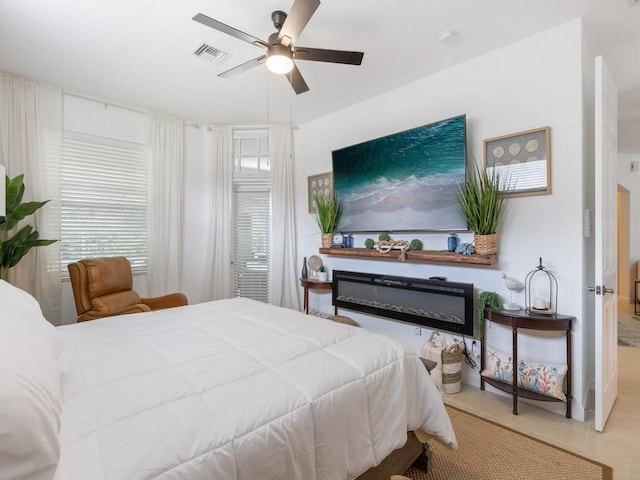 tiled bedroom with ceiling fan