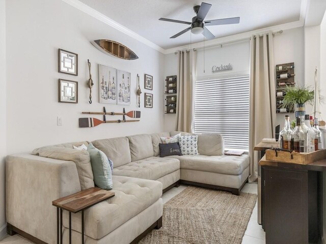 living room featuring ceiling fan and ornamental molding