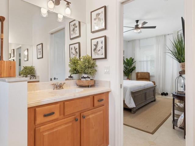 bathroom featuring tile patterned floors, ceiling fan, and vanity