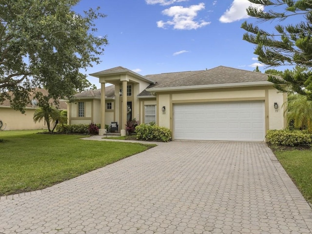 prairie-style house with a garage and a front lawn