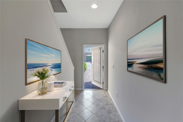 foyer with baseboards, recessed lighting, and light tile patterned flooring