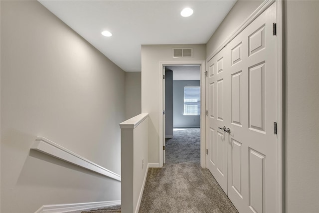 hallway featuring carpet floors