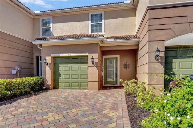 doorway to property featuring a garage