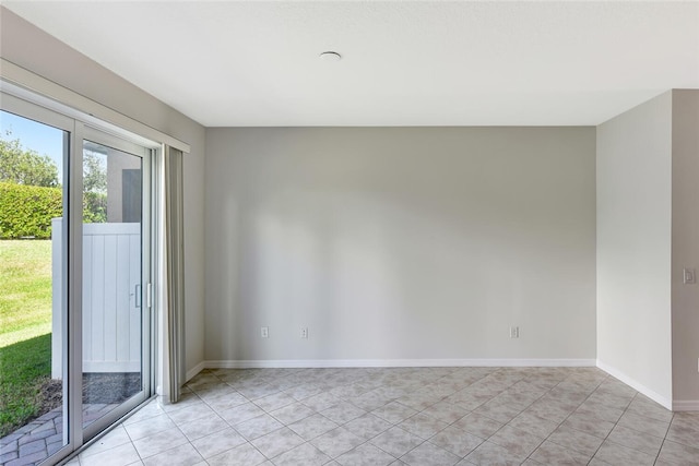 empty room with light tile patterned floors