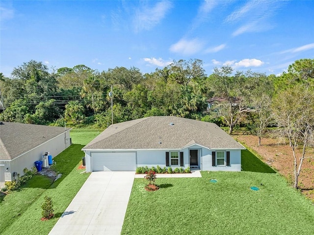 ranch-style home featuring a front yard and a garage