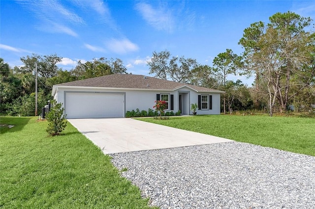 ranch-style home featuring a front lawn and a garage