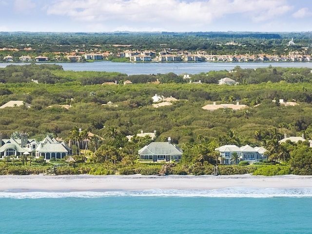 aerial view with a water view and a beach view