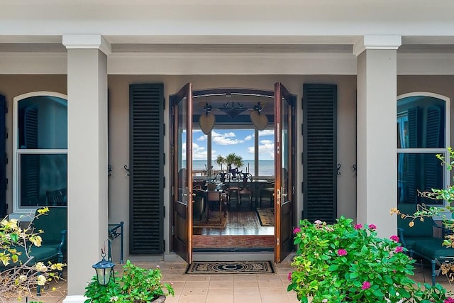 view of exterior entry with covered porch