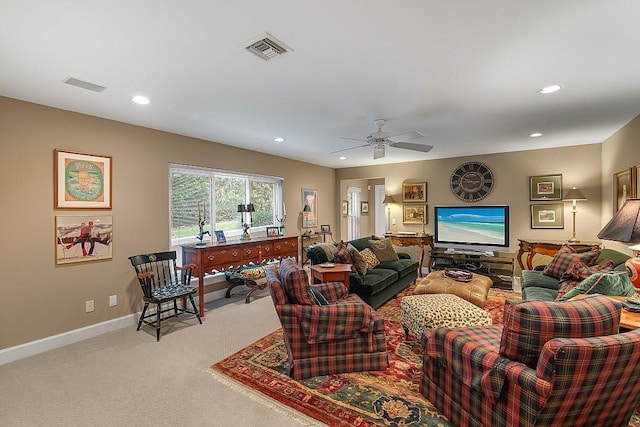 carpeted living room with ceiling fan