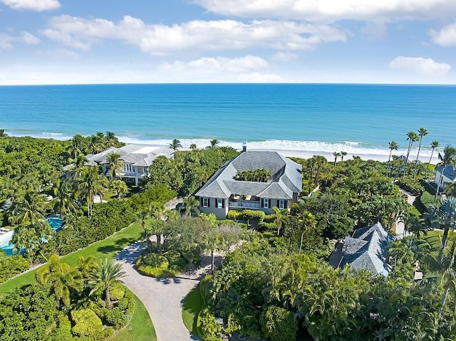 birds eye view of property featuring a water view and a view of the beach