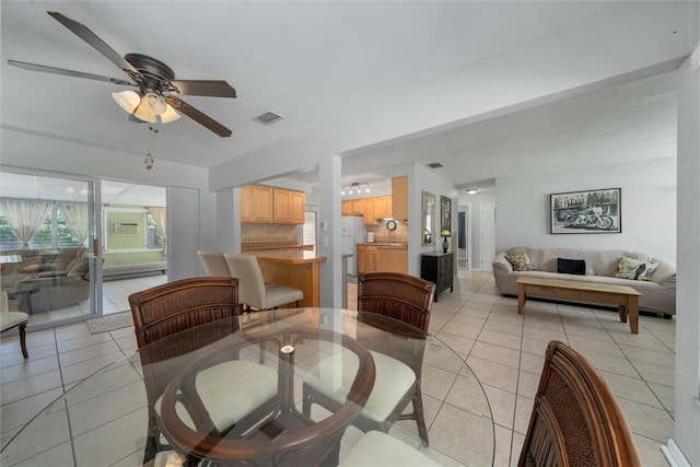 tiled dining room with ceiling fan