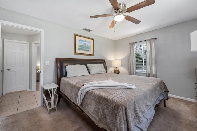 bedroom with tile patterned flooring and ceiling fan