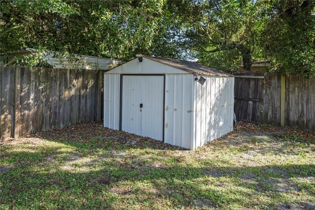 view of outdoor structure featuring a lawn