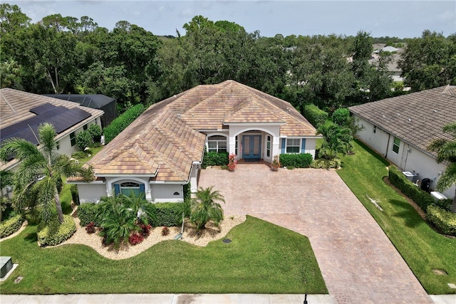 view of front facade featuring a front yard and french doors