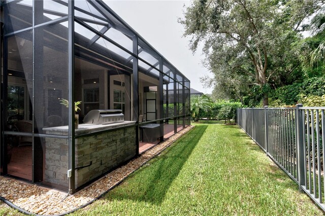 view of yard with a lanai