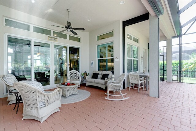 view of patio featuring ceiling fan and an outdoor living space