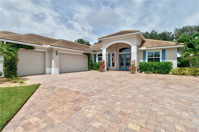 mediterranean / spanish-style home featuring a garage