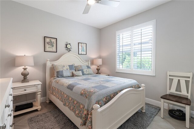 tiled bedroom with ceiling fan