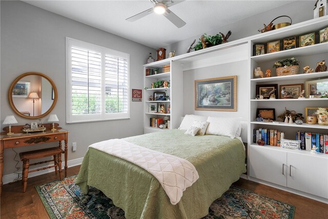 bedroom featuring dark hardwood / wood-style flooring and ceiling fan