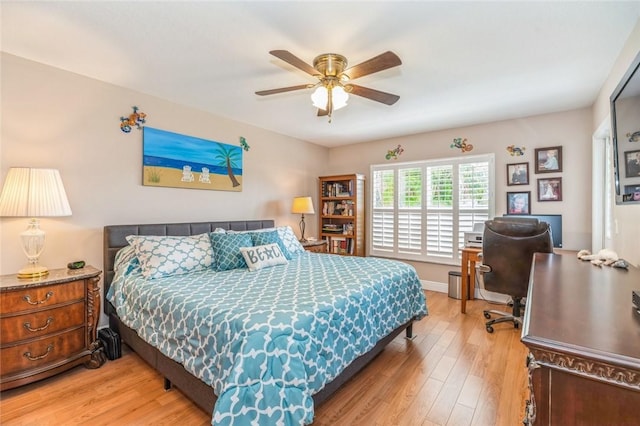 bedroom featuring hardwood / wood-style floors and ceiling fan