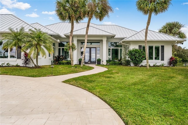 view of front of home with french doors and a front yard