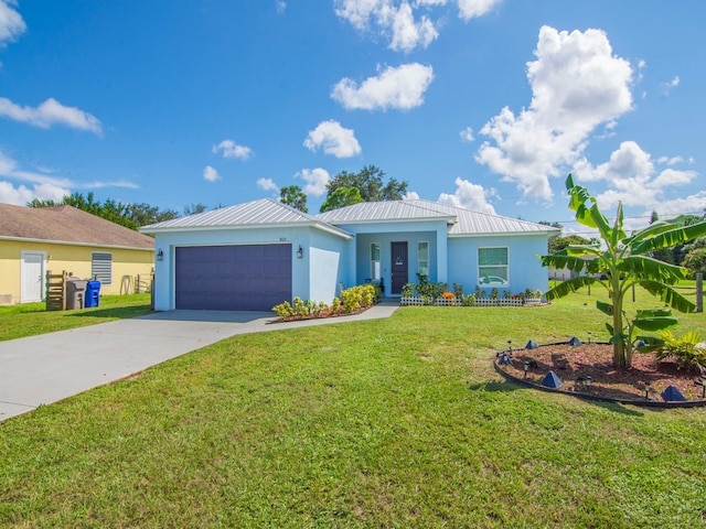 single story home featuring a garage and a front lawn