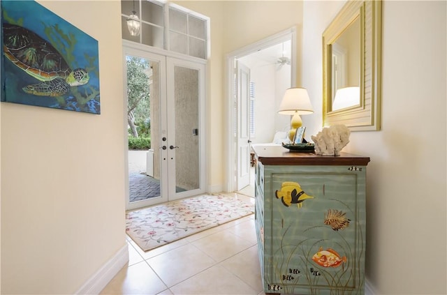 1632 Weybridge Cir, Vero Beach, FL 32963 - entryway with french doors, tile patterned flooring, and baseboards