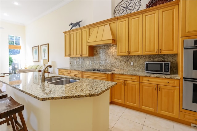 kitchen featuring stainless steel appliances, sink, custom exhaust hood, an island with sink, and crown molding